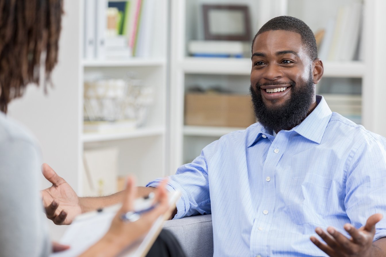 Mid adult man receives counseling